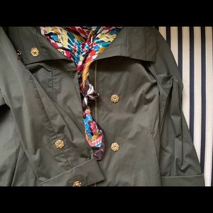 gold-detailed raincoat